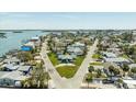 Aerial view showcases the property nestled between connecting roads and surrounded by a charming neighborhood at 13313 3Rd E St, Madeira Beach, FL 33708