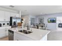 Modern kitchen with stainless steel appliances, center island, and bright natural light at 13434 Tropical Breeze Way, Hudson, FL 34669