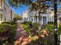 Charming home showcasing manicured landscaping and a welcoming brick pathway at 16127 Churchview S Dr, Lithia, FL 33547