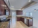 Open kitchen with stainless steel appliances, granite countertops, and breakfast bar at 16127 Churchview S Dr, Lithia, FL 33547