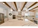 Bright, open kitchen with a large island, modern appliances, and stylish pendant lighting at 21794 Pristine Lake Blvd, Land O Lakes, FL 34637