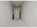 Inviting entryway with a cream-colored front door and a decorative 