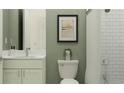 Cozy bathroom featuring a toilet with an art print, a vanity, and a bathtub with a shower curtain at 4807 Southern Valley Loop, Brooksville, FL 34601