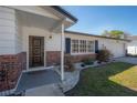 Single Gathering home with brick accents, well-kept landscaping and an attached two car garage at 6765 Ralston Beach Cir, Tampa, FL 33614