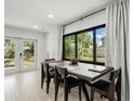 Elegant dining room with large windows and access to the backyard at 8721 N Whittier St, Tampa, FL 33617