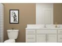 Modern bathroom featuring a white vanity with sleek hardware and stylish decor at 12965 Shining Blue Nile Ln, Parrish, FL 34219