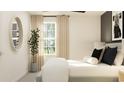Serene bedroom with soft natural light, neutral tones, and elegant decorative accents at 12965 Shining Blue Nile Ln, Parrish, FL 34219