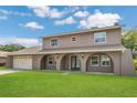 Charming two-story home with a manicured front lawn and a spacious two-car garage at 16528 Oley Ridge Ct, Tampa, FL 33624