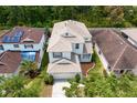 Aerial view of a two-story home with well-maintained lawn and landscaping, a driveway, and a 2 car garage at 20123 Bay Cedar Ave, Tampa, FL 33647