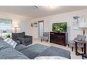 Inviting living room with a comfortable seating arrangement and neutral decor at 4101 W Nassau St, Tampa, FL 33607