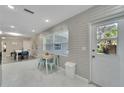 Eat-in kitchen with white cabinets, modern appliances, and an abundance of natural light at 4753 48Th N Ave, St Petersburg, FL 33714