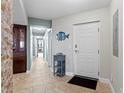 Inviting entryway with stone accents and decorative fish art welcomes you home at 5353 Gulf Blvd # B103, St Pete Beach, FL 33706
