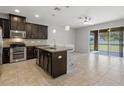 Modern kitchen with stainless steel appliances, granite countertops, and an open layout at 6872 40Th N Ln, Pinellas Park, FL 33781