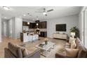 Open-concept living space with a seamless transition to the kitchen, perfect for entertaining and modern living at 6872 40Th N Ln, Pinellas Park, FL 33781