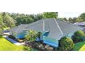 Charming single-story home featuring a beautiful tiled roof and well-manicured front yard at 9159 Highland Ridge Way, Tampa, FL 33647