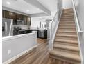 Open concept interior with staircase, and view of kitchen with stainless steel appliances at 10212 Westpark Preserve Blvd, Tampa, FL 33625