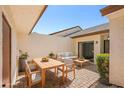 Stylish outdoor patio with dining and seating areas perfect for entertaining at 14926 Feather Cove Rd, Clearwater, FL 33762