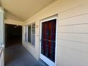 Inviting condo entrance with stylish door, decorative bars, and clear unit number at 2331 Finlandia Ln # 73, Clearwater, FL 33763