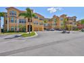 Beautiful condo with a large parking lot and palm trees, offering convenience and a tropical feel at 2739 Via Capri # 1024, Clearwater, FL 33764