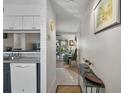 Bright hallway leading to a living room with tile flooring and a view to the back patio at 3001 58Th S Ave # 509, St Petersburg, FL 33712