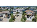 Exterior elevation featuring lush landscaping and a circular driveway at 4363 Biscayne Dr, Hernando Beach, FL 34607