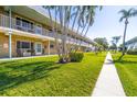 The building's exterior includes a meticulously landscaped lawn, adding to its curb appeal at 5247 81St N St # 4, St Petersburg, FL 33709