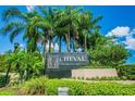 Beautiful signage for the Cheval Golf and Country Club community under a bright blue sky at 6006 Chellas Ct, Lutz, FL 33558