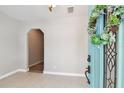 Inviting foyer featuring tiled flooring and an arched doorway to the living space at 6939 3Rd N St, St Petersburg, FL 33702
