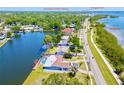 Stunning aerial view of waterfront home in proximity to Philippe Park and Tampa Bay at 775 S Bayshore Blvd, Safety Harbor, FL 34695
