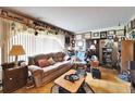 Cozy living room with a comfortable sofa and an array of decorative items at 117 Myrtle Ln, Plant City, FL 33565