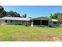 Large backyard featuring a screened porch and plenty of green space at 1203 Durant Rd, Brandon, FL 33511
