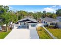 Charming single Gathering home with a beautifully landscaped yard and a long, spacious driveway at 1820 Mississippi Ave Ne, St Petersburg, FL 33703