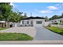 Charming single Gathering home with a beautifully landscaped yard and a long, spacious driveway at 1820 Mississippi Ave Ne, St Petersburg, FL 33703
