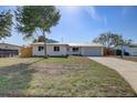 Single-story home with a freshly painted exterior, well-kept landscaping, and a long driveway at 3404 33Rd Street W Ct, Bradenton, FL 34205