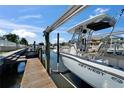Boat on a lift at private dock; enjoy waterfront living at 426 Islebay Dr, Apollo Beach, FL 33572
