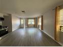 Spacious living room with neutral paint, modern floors, and natural light from multiple windows at 4316 70Th N Ave, Pinellas Park, FL 33781