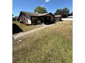 Charming single story home featuring neutral paint, decorative rock, and a walkway to the front door at 4556 Blossom Blvd # B, Zephyrhills, FL 33542