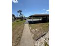 Community parking lot with covered parking at 4556 Blossom Blvd # B, Zephyrhills, FL 33542
