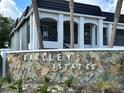 A decorative stone sign for Barclay Estates with white block letters and short palm trees at 8651 10Th N St # 236, St Petersburg, FL 33702