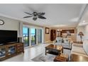 Inviting living space with an open floor plan to a kitchen and sliding doors with beach views at 1480 Gulf Blvd # 103, Clearwater Beach, FL 33767