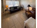 Comfortable living room featuring tile flooring and natural light at 2050 58Th N Ave # 6, St Petersburg, FL 33714