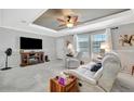 Comfortable living room featuring neutral colors, ceiling fan, large windows, and plush seating, perfect for relaxation at 262 S Port Royal Ln, Apollo Beach, FL 33572