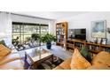 Inviting living room with ample natural light, comfortable seating, and stylish decor overlooking the yard at 2900 Cove Cay Dr # 1B, Clearwater, FL 33760