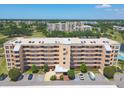 Beautiful condo complex showing well-maintained landscaping, ample parking, and residential buildings at 4550 Pinebrook Cir # 505, Bradenton, FL 34209