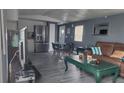 Open concept living room with kitchen, dining area, and comfortable seating arrangement at 5830 Portsmouth Dr, Tampa, FL 33615
