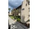Property featuring clean landscaping with parking space; ideal for residents and visitors at 825 S Village N Dr # 201, St Petersburg, FL 33716