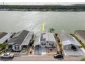 Waterfront home with solar panels, covered parking, and easy access to the lake for recreation at 8444 Fantasia Park Way, Riverview, FL 33578