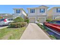Attractive townhomes feature a well-manicured lawn and private driveways at 10947 Verawood Dr, Riverview, FL 33579