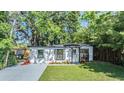 Charming single story home features a well manicured lawn, fresh landscaping, and neutral exterior at 120 12Th N Ave, Safety Harbor, FL 34695