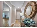 Entry hallway with wood-look flooring, a decorative mirror, and an adjacent office space with bright natural light at 19817 Gulf Blvd # 602, Indian Shores, FL 33785